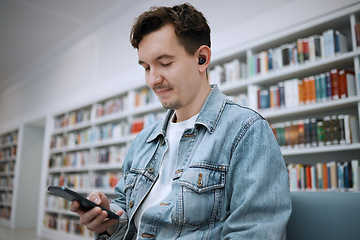 Image showing Phone, library and student listening to music for education podcast, mental health and relax at university for learning. Person or man on smartphone, audio technology for campus or college study info