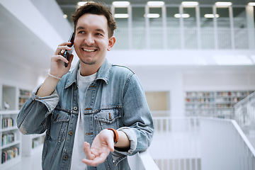 Image showing Man, phone call and communication at library for conversation, discussion or advice. Happy male with smile talking on mobile smartphone in big book store or study for decision making, choice or idea