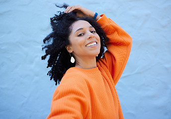 Image showing Happy, fashion and portrait of black woman on blue background with smile, positive mindset and peace. Happiness, beauty and face of girl relax in city with urban style, trendy and stylish clothes