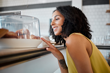 Image showing Coffee shop, happy and woman looking at croissants for breakfast, snack or delicious craving. Happiness, smile and female buying a fresh baked pastry by a cafe, restaurant or bakery in Puerto Rico.