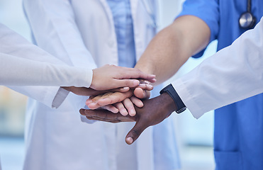 Image showing Healthcare, teamwork and hands together in huddle for team building, collaboration and motivation at hospital. Doctors, diversity and medical employees in solidarity for help and support in medicine.