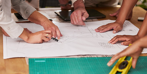 Image showing Hands, collaboration and architecture with a designer team planning on a table using a blueprint. Building, planning and teamwork with an engineer employee group at work on project development