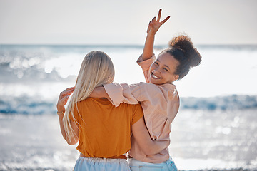 Image showing Hug, peace sign and portrait of friends at the beach for summer, holiday and bonding in Miami. Travel, freedom and back of women with hand emoji for carefree energy, playful and happy by the sea