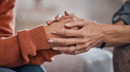 Image showing Women, holding hands and closeup for therapy, mental health support or consultation for problem on sofa. Woman, helping hand and psychologist for wellness conversation, advice or care for depression