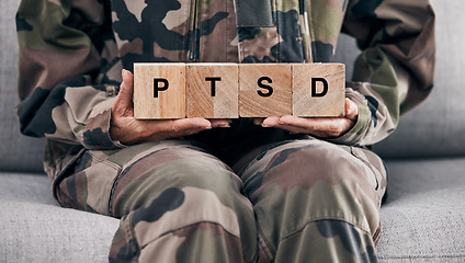 Image showing Soldier hands, holding wood block and sofa for therapy, ptsd and help for mental health problem from Ukraine war. Military professional, wooden sign or depression on couch after international combat