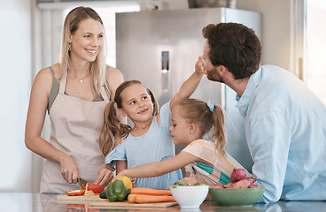 Image showing Family, parent and children cooking in kitchen with vegetables for healthy diet, nutrition or meal prep. Bonding, smile and mom, dad and girls learning, teaching and helping cut food ingredients