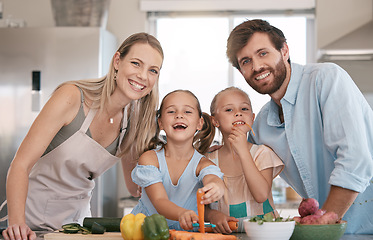 Image showing Portrait of mom, dad and children cooking in kitchen with vegetables for healthy lunch, food or diet. Family, smile and parents with girls learn chef skills and help cut ingredients for meal prep