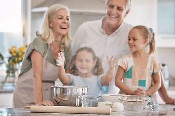 Image showing Love, grandparents and girls baking, quality time and bonding on weekend, break and happiness. Child development, granny and granddad with female grandchildren, fun and loving together and cooking