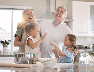 Image showing Funny family, baking and children helping grandparents in home kitchen with food. Woman, man and girl kids learning to make cookies, pancakes or cake for breakfast with love, care and fun teamwork