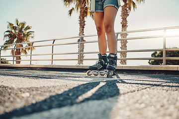 Image showing Hobby, ground and legs of a woman on rollerskates for the weekend, fun activity and summer in Miami. Learning, urban and feet of a girl rollerskating on the floor in the urban city for a cool sports