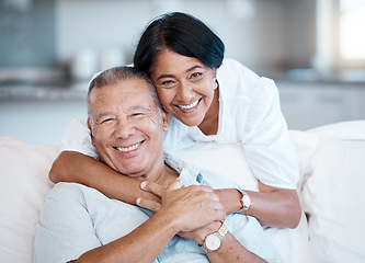 Image showing Love, retirement and portrait with a senior couple in the living room of their home together to relax. Sofa, bonding or marriage with a mature man and woman relaxing in the lounge of their house