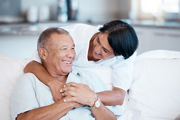 Image showing Love, retirement and smile with a senior couple in the living room of their home together to relax. Sofa, bonding or marriage with a mature man and woman relaxing in the lounge of their house