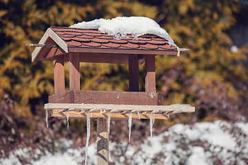 Image showing birdhouse in winter garden