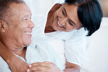 Image showing Love, retirement and smile with an old couple in the living room of their home together to relax. Sofa, bonding or marriage with a senior man and woman relaxing in the lounge of their house