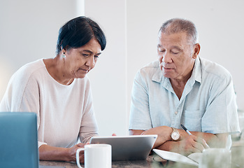 Image showing Senior couple, tablet and home of elderly people in retirement looking at web data. Digital, house research and marriage of a Indian woman and man together in a house streaming a internet video