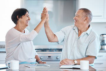 Image showing High five, tablet and senior couple in kitchen happy for success in online banking, ecommerce and internet. Love, retirement and elderly man and woman celebrate with digital tech, notebook and smile