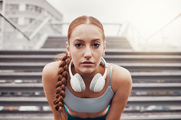 Image showing Fitness, sports and portrait of woman in city with motivation, determination and focus for health goals. Running, exercise and face of girl in urban town for workout, wellness and marathon training