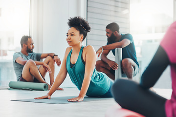 Image showing Yoga, fitness class and people exercise together for health, peace and wellness. Black woman and men group in health studio for holistic workout, cobra and body balance with zen energy or mindfulness