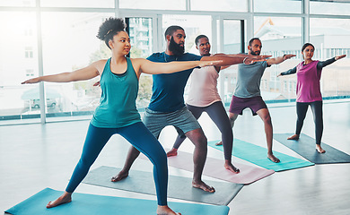 Image showing Yoga class, warrior exercise and people together for fitness, peace and wellness. Diversity men and women in health studio for holistic stretching workout, mental health and body balance for energy