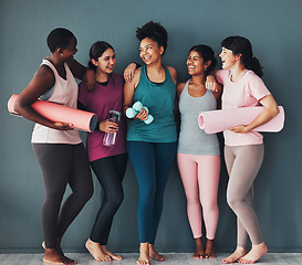 Image showing Yoga women, fitness friends and diversity of pilates class in a gym studio with a exercise and training break. Talking, wellness people and communication of group ready for zen, balance and relax