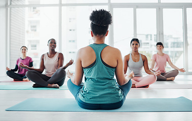 Image showing Yoga class, fitness instructor and meditation exercise with people in lotus for fitness and wellness. Diversity women in health studio for holistic workout, mental health and body balance or peace