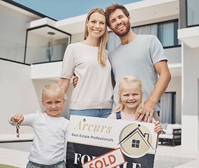 Image showing Real estate, house and portrait of family with keys and a sign for moving, property and homeowner. Happy, showing and parents with children, board and relocation after buying a new home from realtor