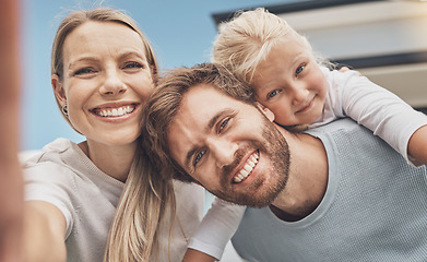 Image showing Selfie, happy and portrait of a family at their house after moving, relocation and buying a home. Real estate, mortgage and face of a mother, father and child with a photo outside of a new apartment