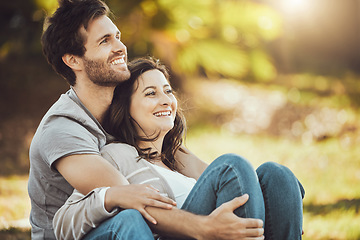 Image showing Couple, love and relax at park, laughing at funny joke or comic comedy and having fun time together outdoors. Valentines day, romance hug and care of happy man and woman sitting on romantic date.