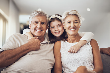 Image showing Relax, portrait or grandparents hug a girl in living room bonding as a happy family in Berlin with love. Retirement, smile or elderly man relaxing old woman with child at home together on fun holiday