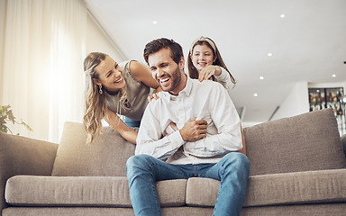 Image showing Laughing, family or bonding in tickle game on home sofa, living room or house for funny, comic or comedy activity. Smile, happy or child ticking father with mother, mom or woman in silly or goofy fun