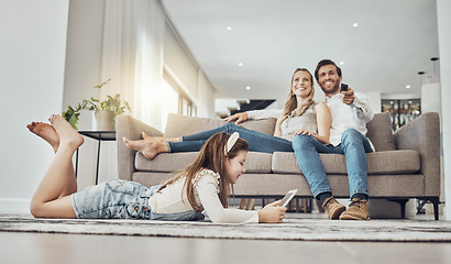 Image showing Happy family, relax or child on tablet in living room, house or home live streaming, movies channel or internet show bonding. Smile, parents or kid girl on technology, television or watching tv media