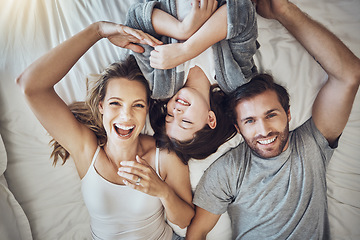 Image showing Happy family relax together, parents and child in bed on the weekend, break with love, care and bonding at home. Portrait, happiness and joy, man, woman and girl laugh and peace with quality time