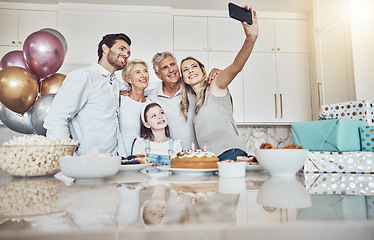 Image showing Birthday party, cake and family selfie in kitchen for happy memory, social media or profile picture. Love, food and girl, mother and grandparents taking pictures or photo together to celebrate event.