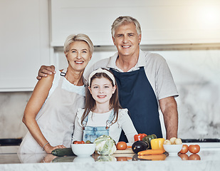 Image showing Portrait, grandparents or child cooking as as happy family in a house kitchen with organic vegetables for dinner. Grandmother, old man and young girl bonding or helping with healthy vegan food diet