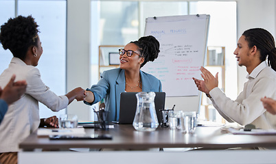 Image showing Handshake, success or applause of business people in a meeting or presentation for sales goals or deal. Partnership, b2b collaboration or happy black woman shaking hands with a manager in leadership