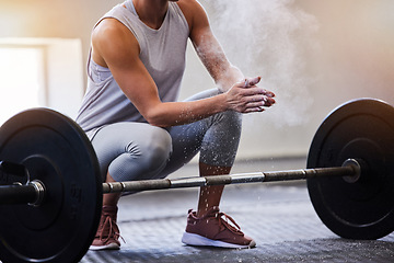 Image showing Hands, bodybuilding and powder with a woman weight lifter getting ready to exercise or workout at gym. Fitness, grip and training with a female bodybuilder weightlifting for strong muscles or health