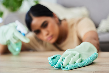 Image showing Hand, cleaning and cloth with a woman housekeeper wiping a wooden furniture surface using disinfectant. Gloves, wipe and hygiene with a female cleaner in a home for housekeeping or sanitizing