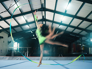 Image showing Gymnastics, motion blur and ribbon dance with a woman in a gym training for the olympics competition. Fitness, art and rhythmic dancing with female gymnast in a studio for a workout or exercise