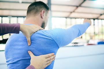 Image showing Help, fitness and man with a gymnastics personal trainer for perfect form, stretching and training. Warm up, performance and coach helping a gymnast with back coordination exercise for sports