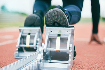 Image showing Race track, start blocks and running with athlete feet, run in stadium and ready with action and fitness outdoor. Person training, runner sneakers and sports workout with exercise and cardio