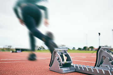 Image showing Motion blur, running and race start blocks with athlete on stadium, person and speed, action and fitness outdoor. Training, runner sneakers and sports with exercise and cardio on track