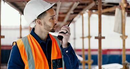 Image showing Logistics worker, walkie talkie and man on a construction site working on a building project. Architecture, communication and engineer talking on a radio while doing home maintenance or renovation.