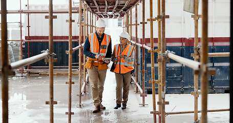 Image showing Construction worker, working together and conversation with tablet, communication and construction business. Engineer, job site with man and woman talking, collaboration and building trade.