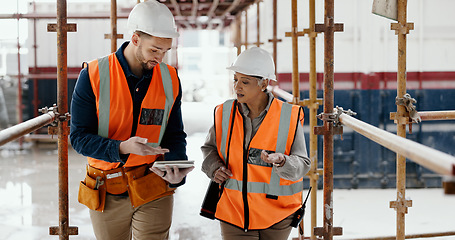 Image showing Construction worker, working together and conversation with tablet, communication and construction business. Engineer, job site with man and woman talking, collaboration and building trade.