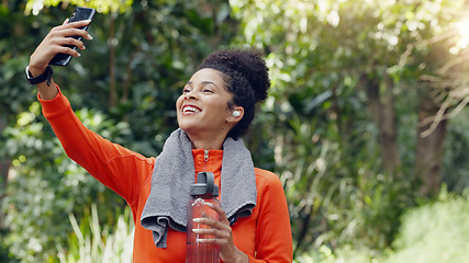 Image showing Wellness, health and selfie by social media influencer advertising exercise, water and hydration. Fitness blogger recording content of weight loss journey while exercising in a park or forest