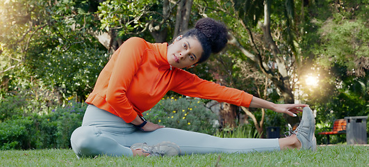 Image showing Stretching, calm and breathing woman on grass in park or nature environment for fitness workout session. Wellness and health lifestyle of sports person doing muscle relax exercise sitting on ground