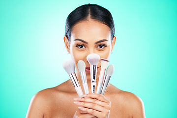 Image showing Makeup, brush and portrait of woman in studio for beauty, skincare or grooming on green background. Face, skin and girl model relax with glamour tool, product or luxury makeover on isolated mockup