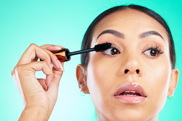 Image showing Woman, face and beauty with mascara for lashes, makeup and cosmetic product with microblading and closeup. Cosmetics, skin and brush in hand for eyelash extension, self care on studio background