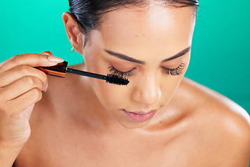 Image showing Mascara, brush and makeup with woman and face, cosmetic product zoom and beauty with lashes in studio. Cosmetics tools for eyelash extension, healthy skin and self care on green background