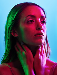 Image showing Model skincare, glowing or neon lighting on isolated blue background and hands on neck, body or skin. Beauty, thinking or woman touching in creative fantasy green, pink or lights aesthetic in makeup